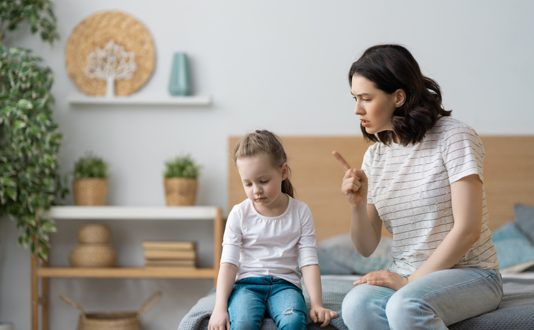 mother is scolding her child girl.