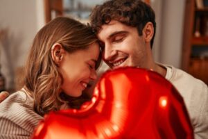 Happy,Valentine's,Day.,Young,Couple,In,Love,Holding,A,Heart-shaped
